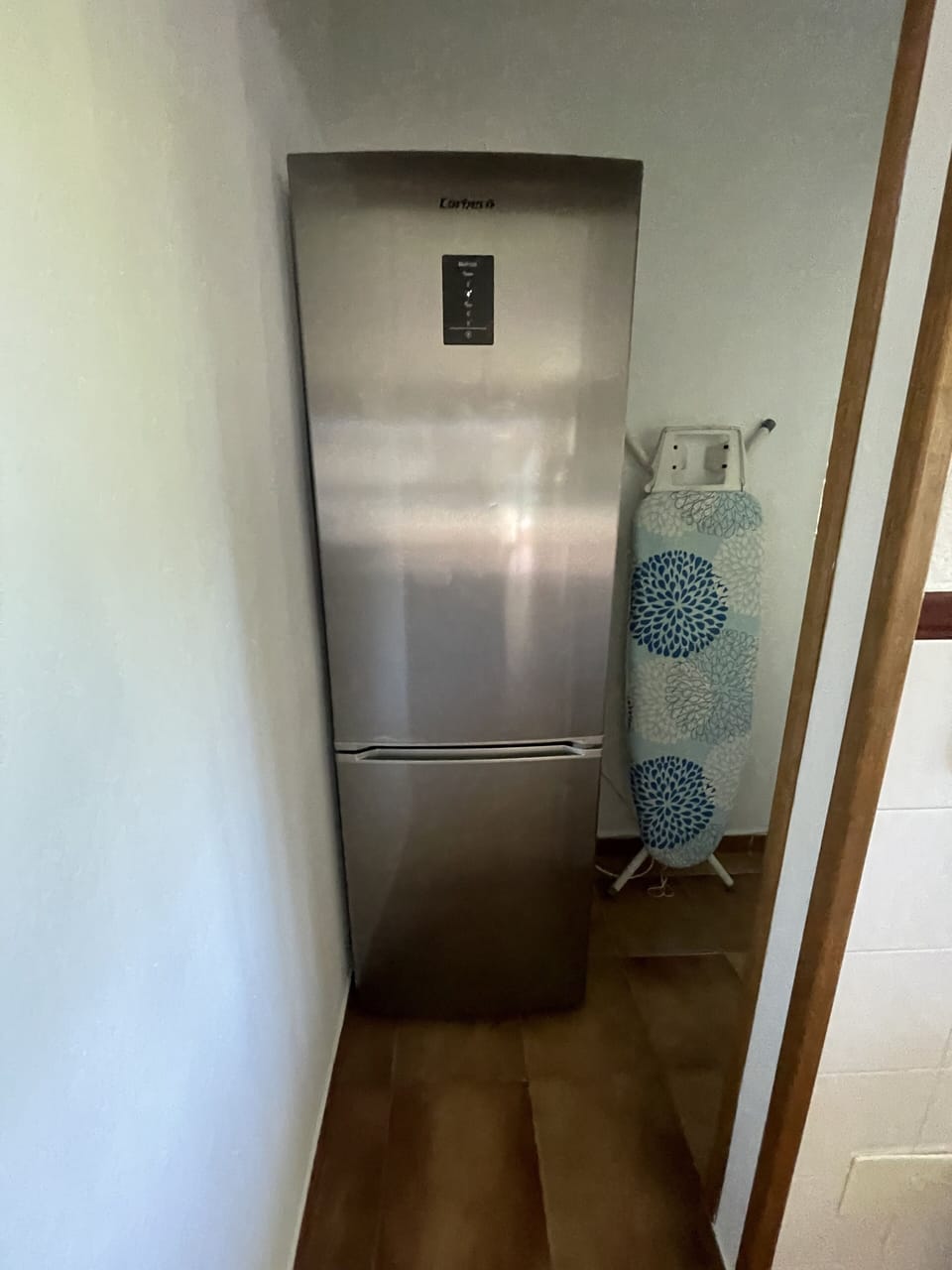 Utility room fridge freezer washing machine and storage. 