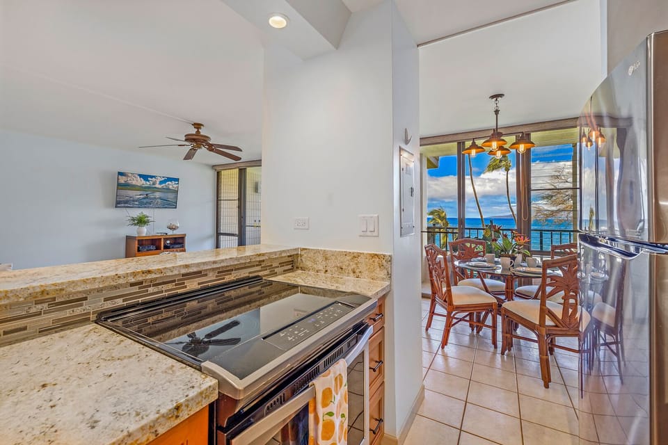 Cook with a view! This fully equipped kitchen features modern appliances, granite countertops, and an open design perfect for entertaining.