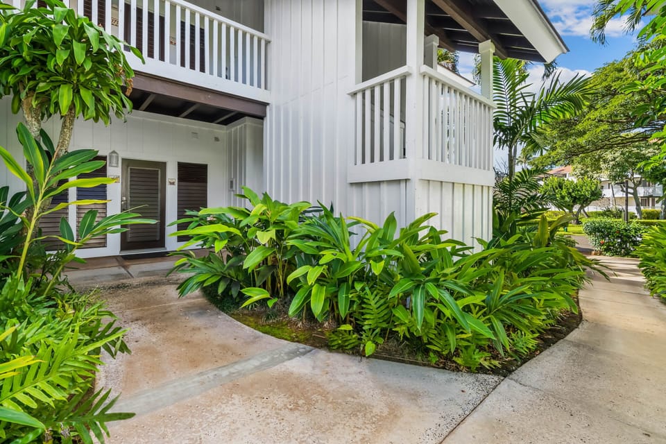 Discover your tropical oasis! Lush greenery and serene pathways invite you to unwind and explore.