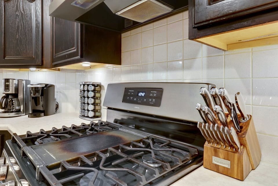 Cook with ease using quality cookware, gas range, and thoughtful details that elevate your stay with A Stay Above The Rest.