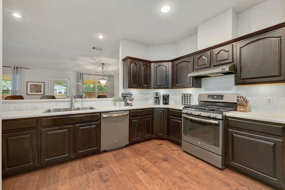 Rich cabinetry, generous counters, and modern appliances create a kitchen designed for comfort and convenience with A Stay Above The Rest.