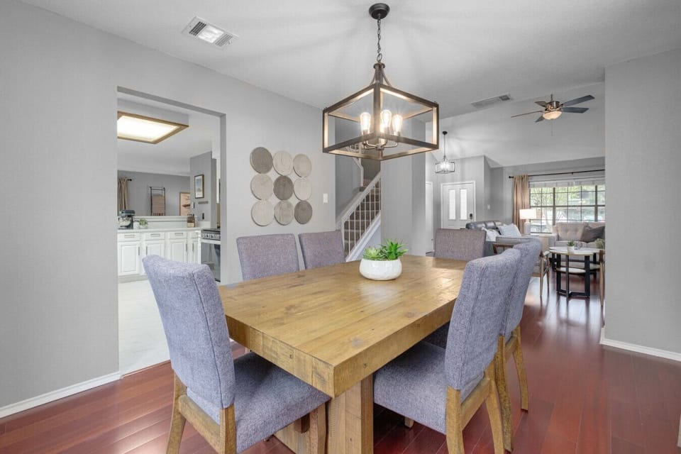 Spacious, fenced backyard with playset and seating makes Boni and Blithe ideal for families and pets.