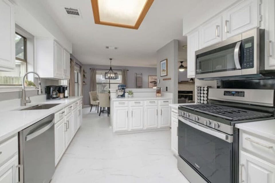 Bright, updated kitchen with stainless appliances and generous counter space for easy family meals or work trips.