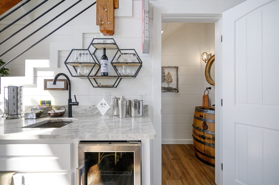 Wet bar and guest bath are conveniently located