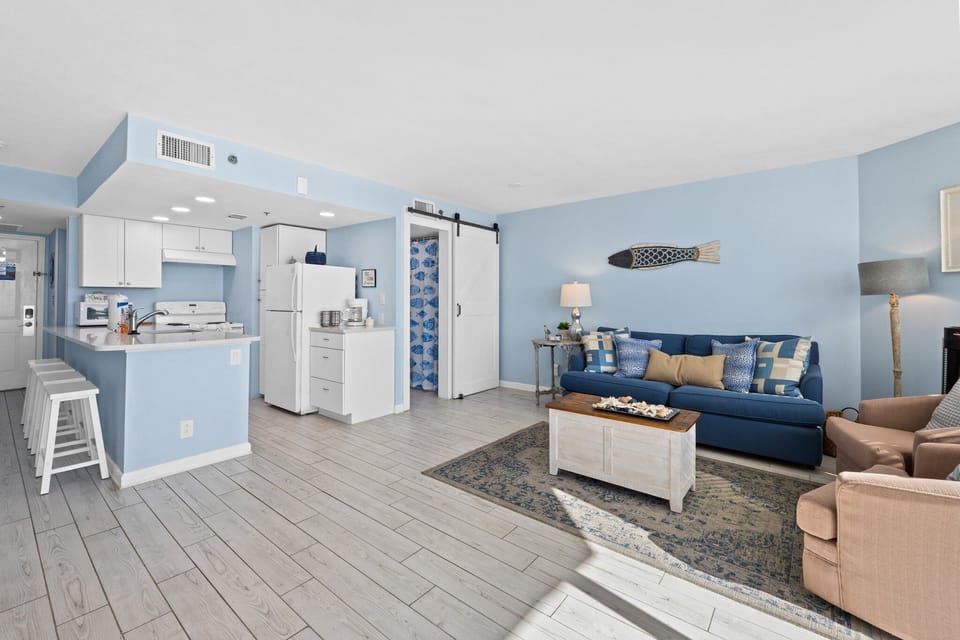 WHITE TILED FLOORS AWAIT YOUR STAY and soft BLUE WALLS FOR RELAXATION