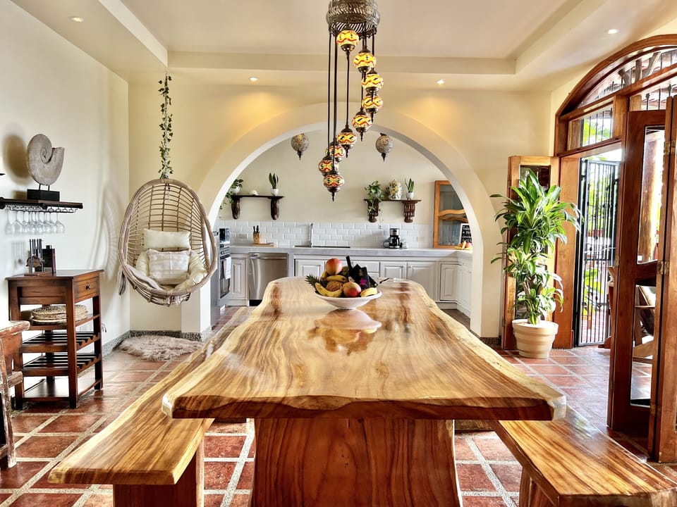 Open concept living room/ dining room. 13 ft. Handmade wood table 