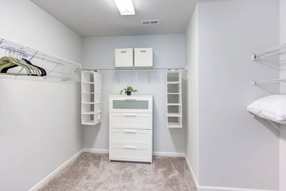 Enormous walk-in closet in the master bedroom could easily fit a crib.(Cary, North Carolina executive furnished rental)