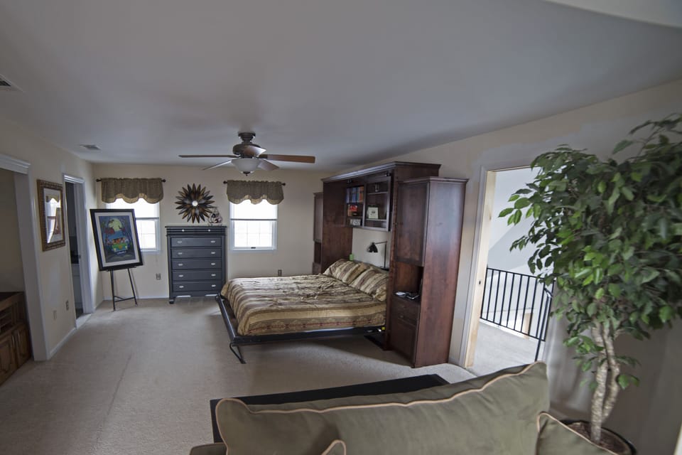 Orchid room showing entrance to the loft and staircase to the sunroom