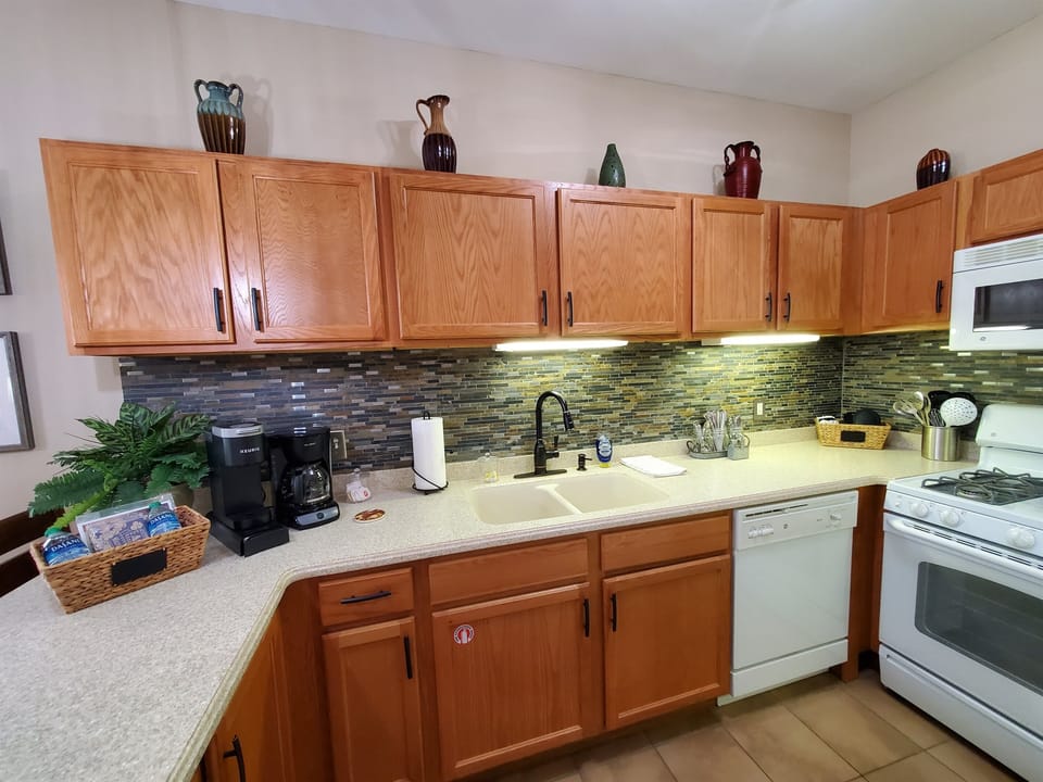 There are plenty of kitchen appliances and ccokware to make a delicious meal.