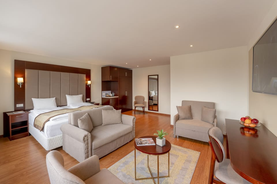Business Quadruple Room | Select Comfort beds, in-room safe, desk, laptop workspace