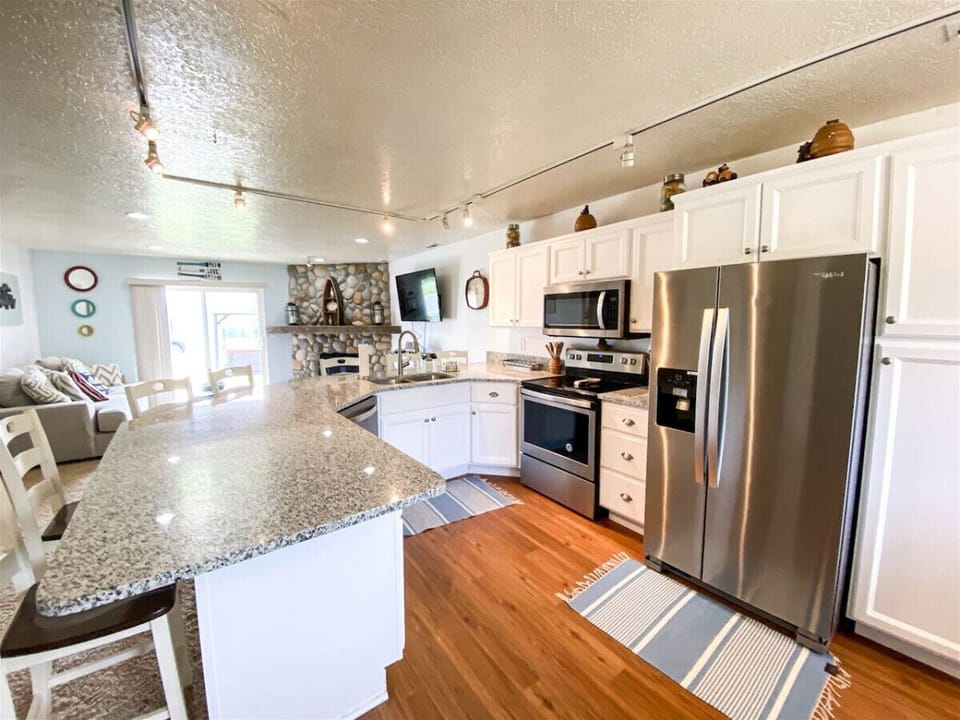 Updated kitchen with stainless steel appliances and granite countertops