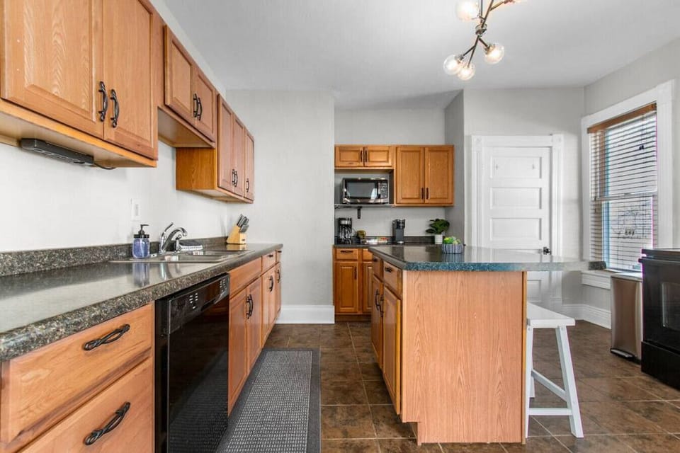 Island in the kitchen offers additional space for cooking and/or seating.