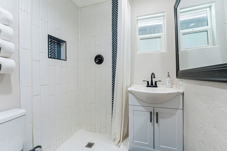 Enjoy the rainfall shower in this clean and remodeled bathroom.