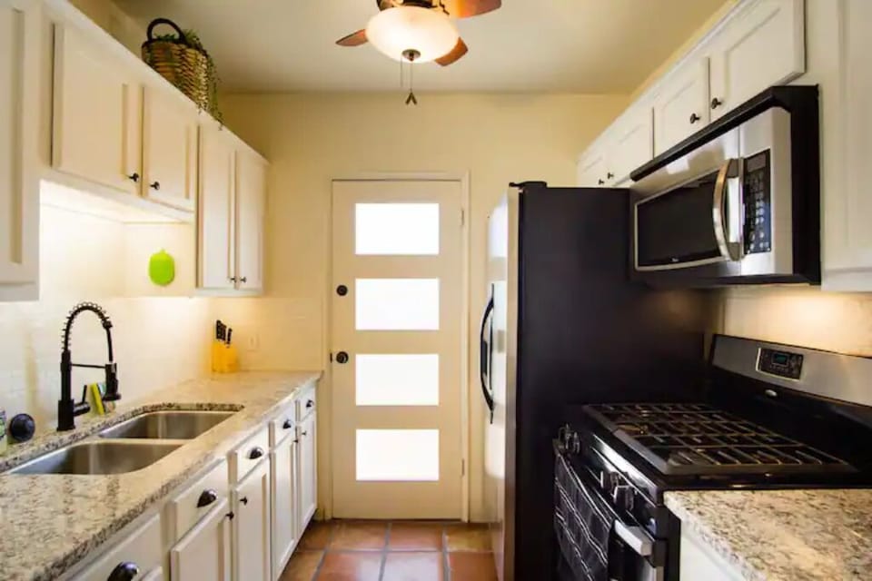 Full size refrigerator, gas stove, granite counters, microwave. Well Stocked.