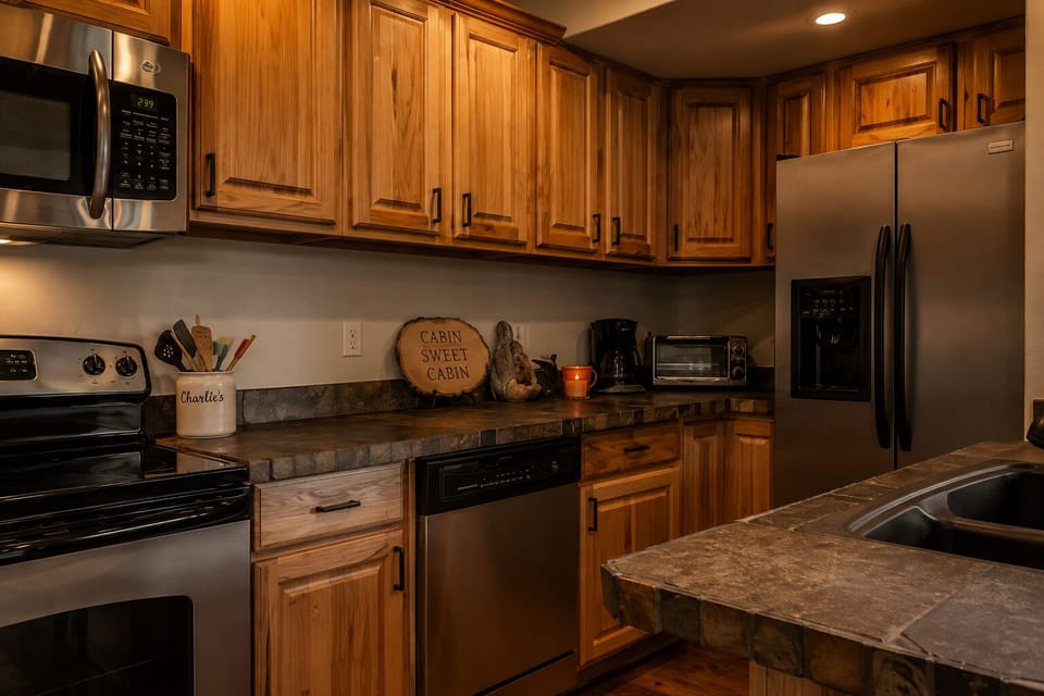 Rustic kitchen with modern amenities in forest cabin