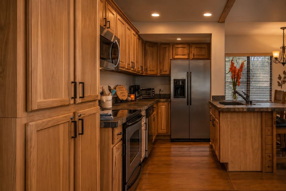 Fully equipped kitchen at Jag Cabin, a dog-friendly Munds Park cabin rental near Flagstaff