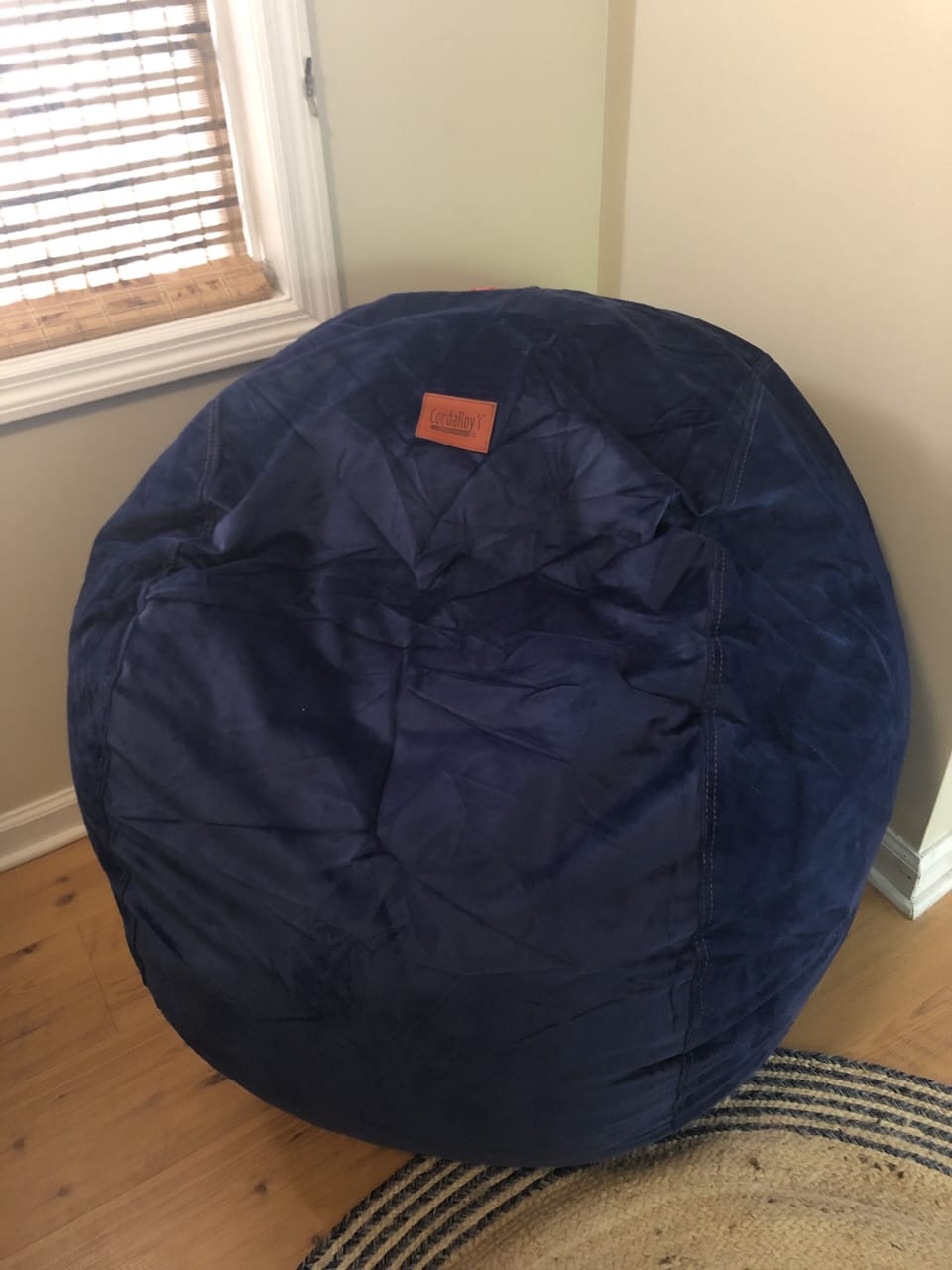 Corduroy beanbag open up to a 60x60” floor mattress big enough for small child. 