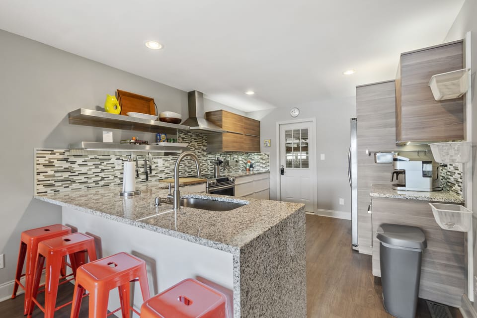 Updated kitchen with new appliances, counters and cabinets, island seating for 4.
