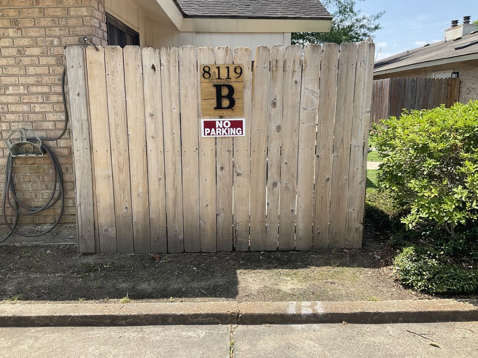 Two reserved parking spaces just feet from the front door 