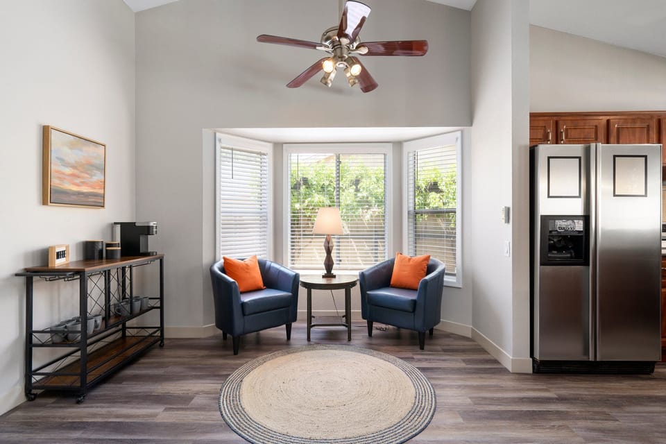 Fully stocked coffee bar and cozy nook to enjoy your morning coffee or a glass of wine while cooking dinner