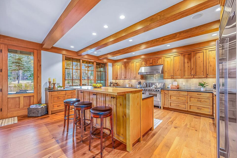 Entertain in style in this luxurious mountain kitchen, featuring upscale finishes and breathtaking views