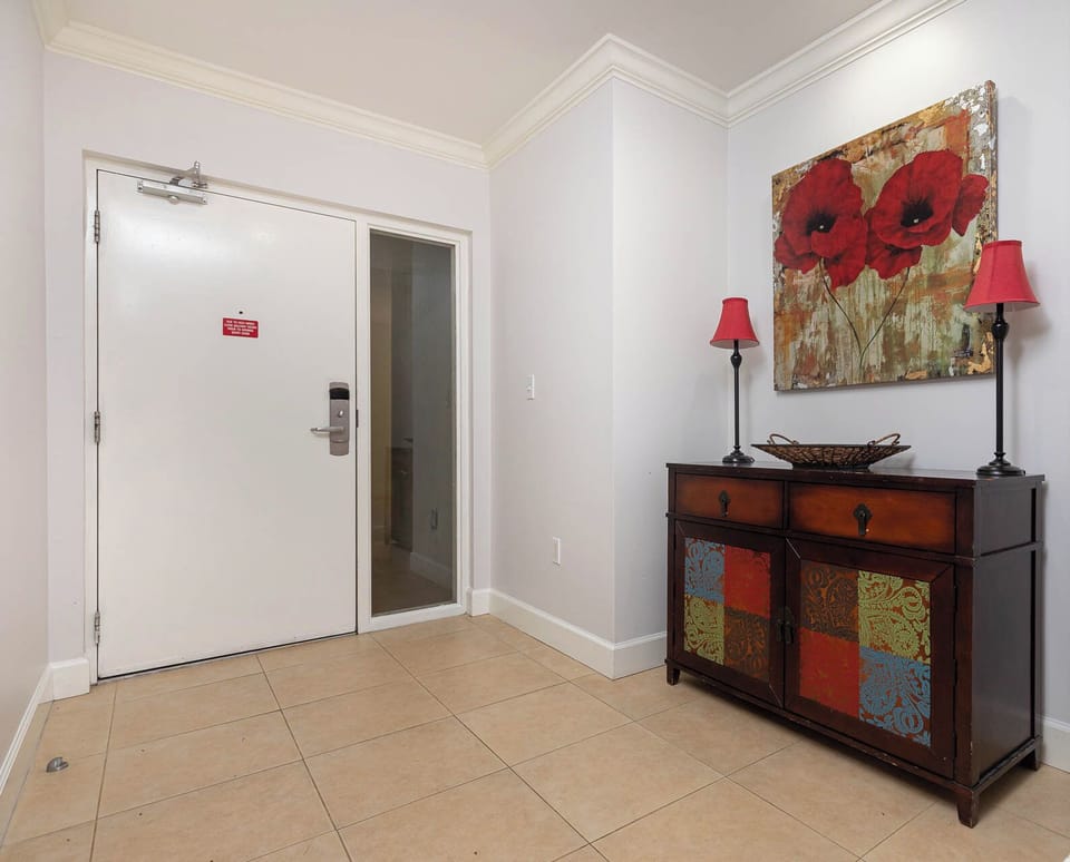 Step inside to a warm welcome, where vibrant art and cozy decor immediately invite you to unwind in style