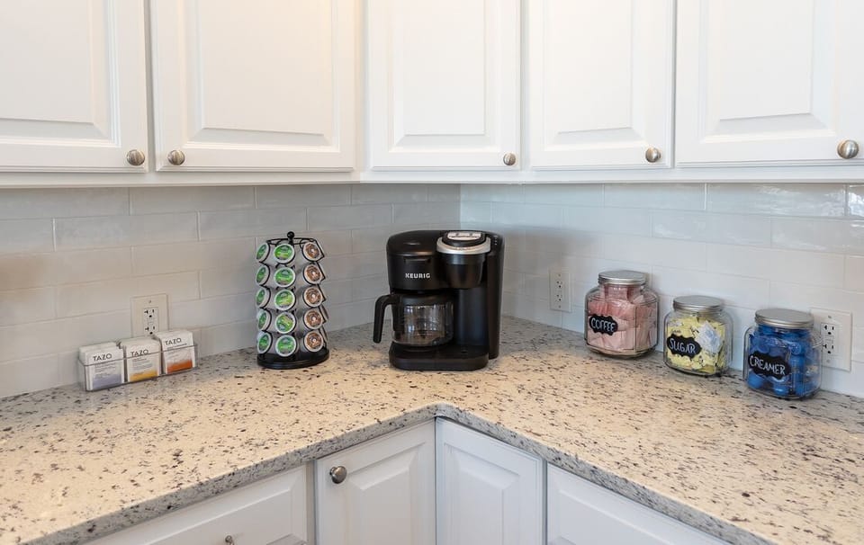 Coffee bar with K-Cups, coffee filter packs, creamer, sweetener and Tazo teas.