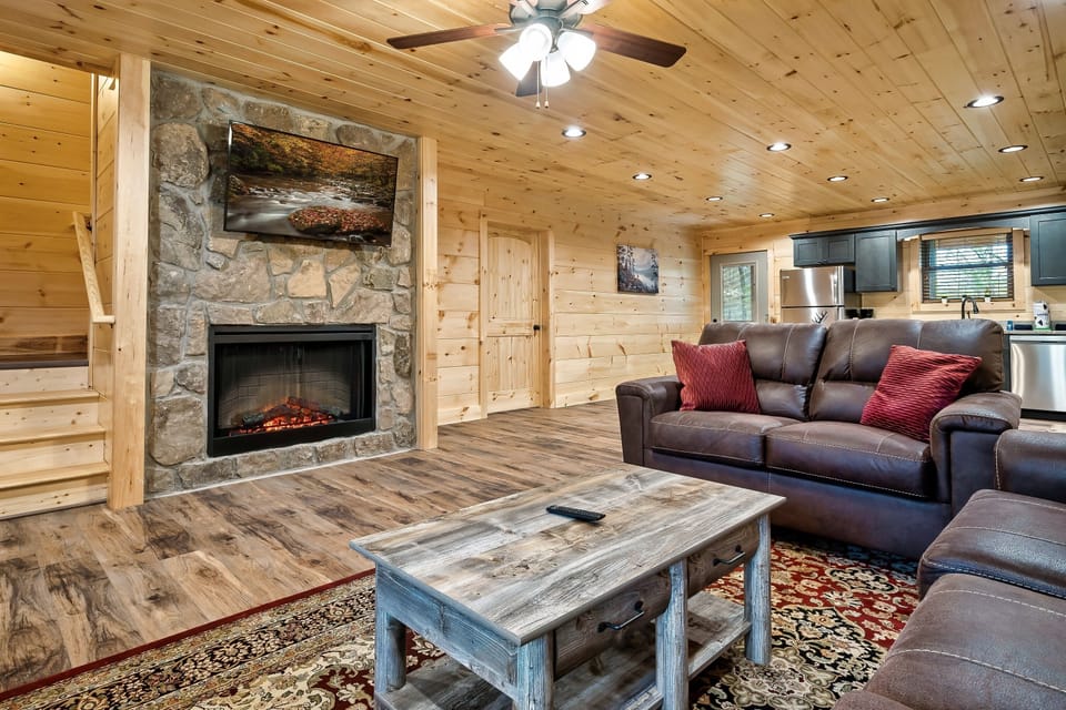 Cozy up by the stone fireplace after a day of Smoky Mountain adventures— no firewood needed