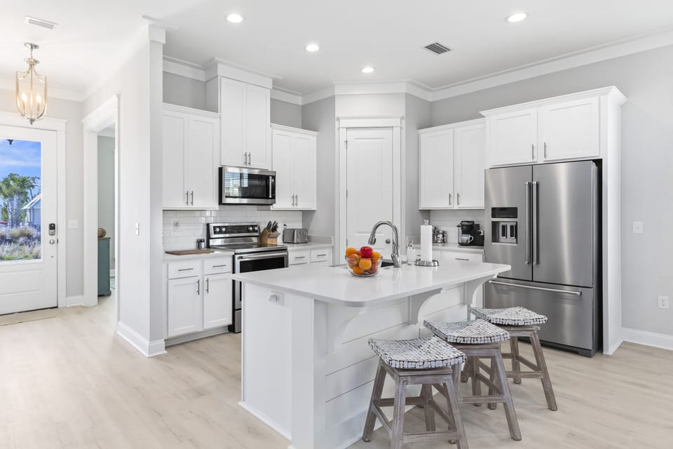 Beach house chef-style kitchen w/ stainless, well-stocked and ready for guests.
