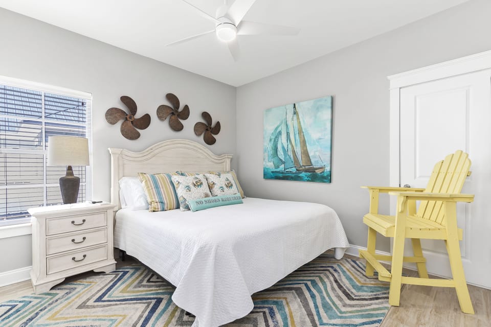 Upstairs boat theme king bedroom with 50" Smart TV & lifeguard chair. 