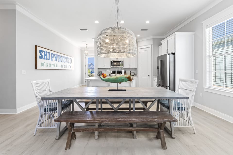 Beach house dining table & island stools provide seating for up to 12 guests.