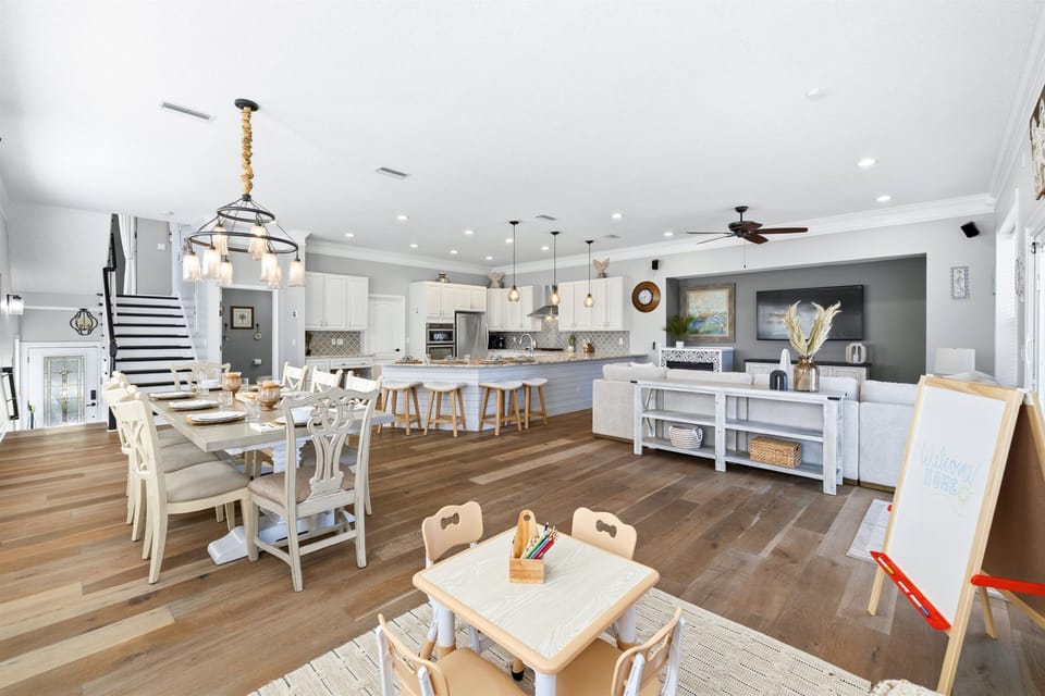 Open-concept main living area with dining, kitchen, and play space — perfect for keeping the whole group connected.