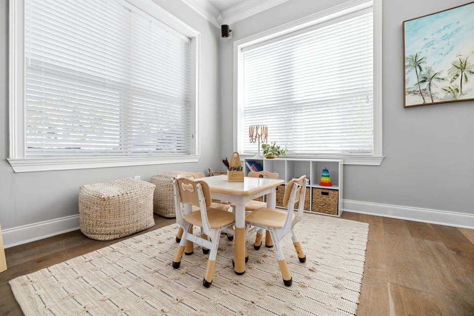 Sweet little play corner designed just for younger guests, with a bright, inviting setup for creative indoor fun.