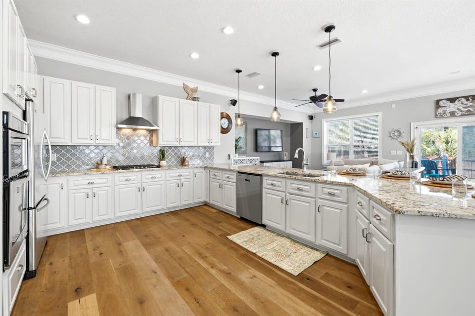 Fully equipped kitchen with generous counter space and modern appliances, designed for effortless meals and entertaining.