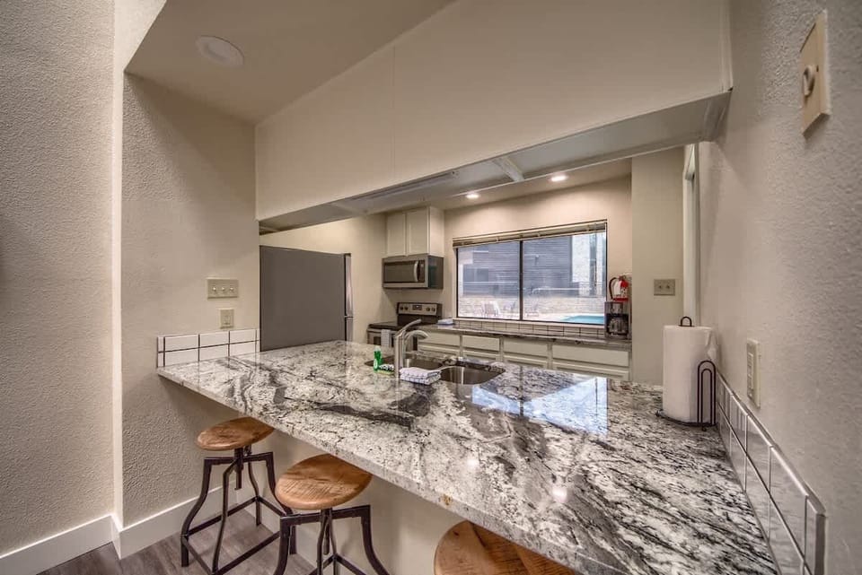 Beautiful counter top/breakfast bar with bar stools.