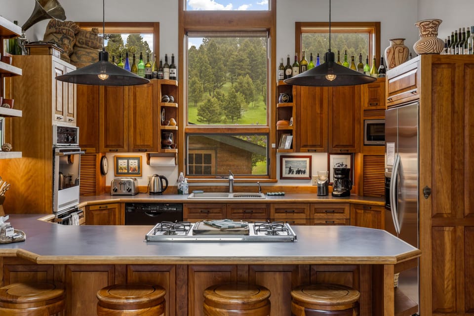 Full kitchen with 4 bar seats at the island.