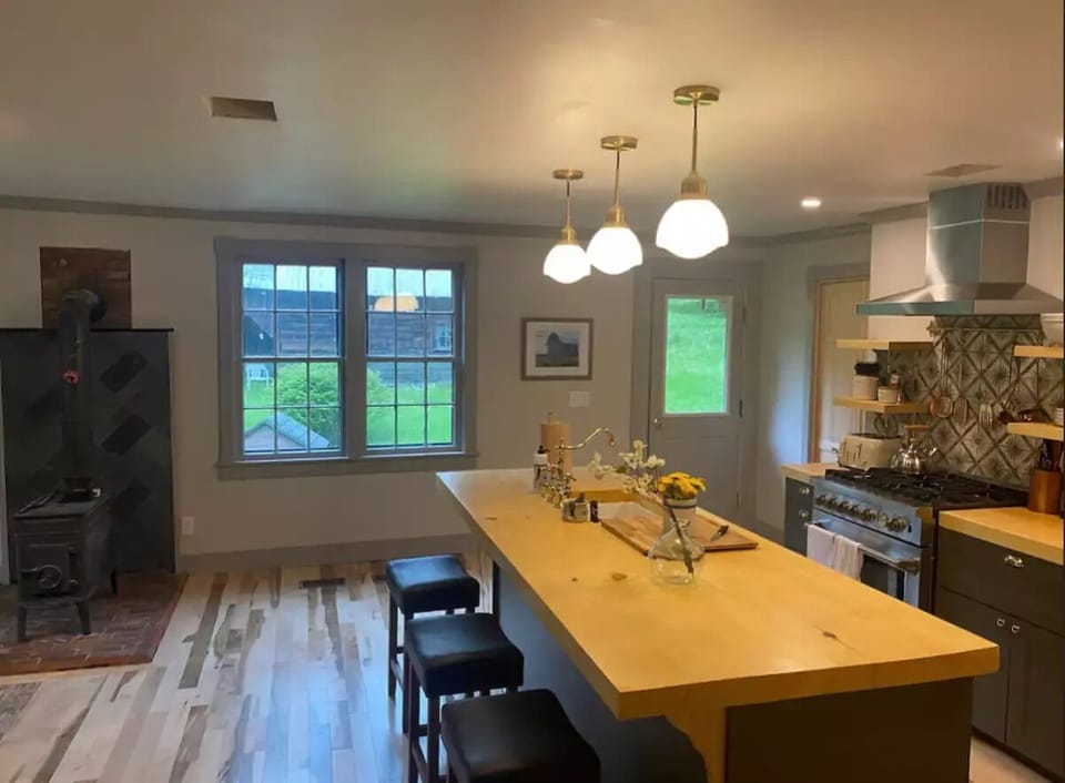 Kitchen with side door leading to backyard and outdoor patio