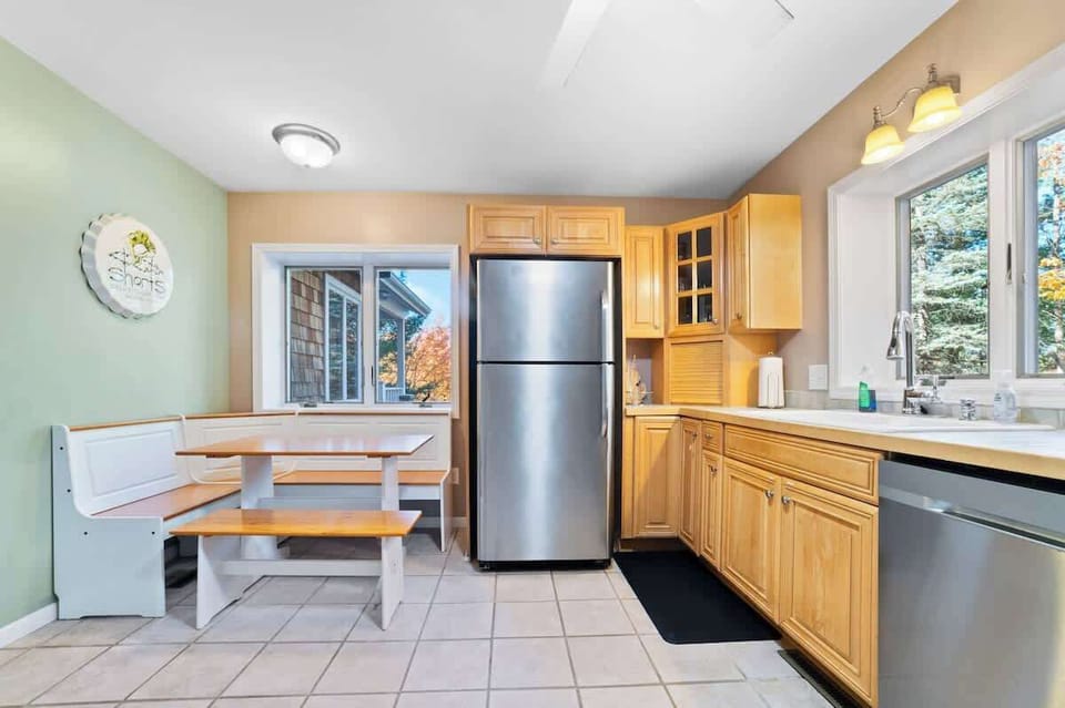 kitchen dining area, dishwasher, childrens dishes.