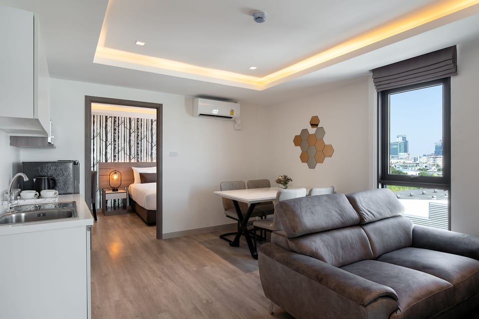 Family Quadruple Room | Living area | 42-inch flat-screen TV with cable channels