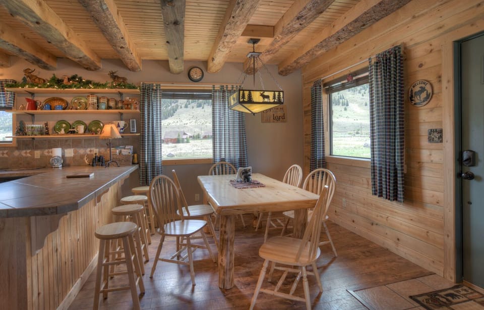 Open dining and kitchen area.  The dining area will seat ten between the table and bar.