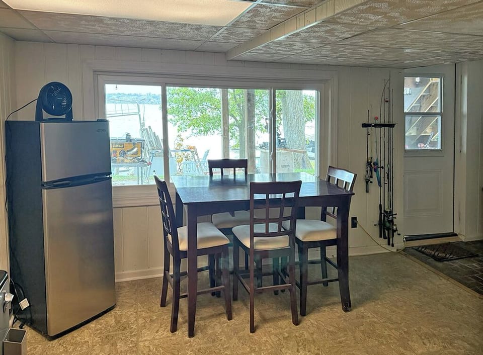Lower level rec room–view of walk-out door to patio, back yard and lake
