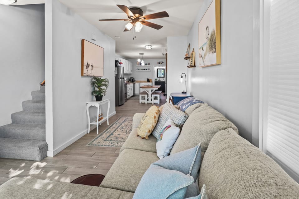 Relax and unwind in the living room with open concept to the kitchen. 
