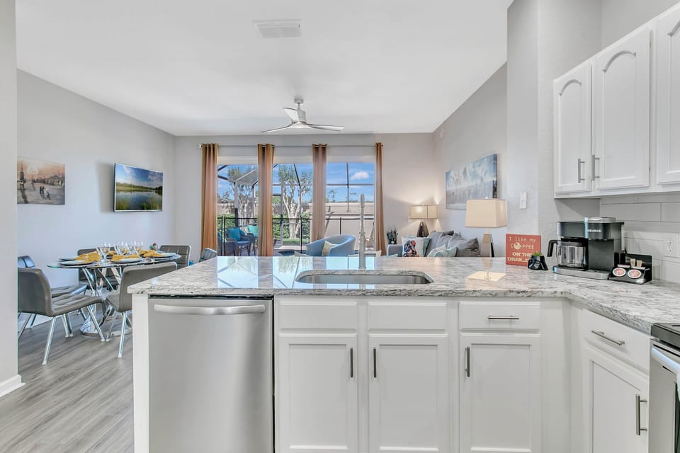 Watch pool fun while cooking in fully-equipped kitchen. Vacation time, have fun!