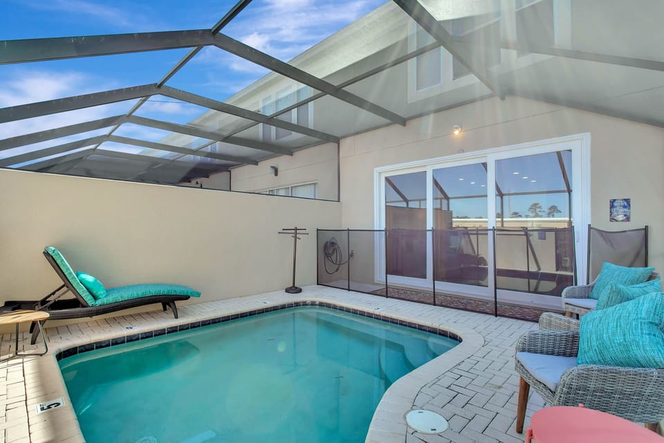 Relax by the screened pool soak up the Florida sun and enjoy your favorite drink
