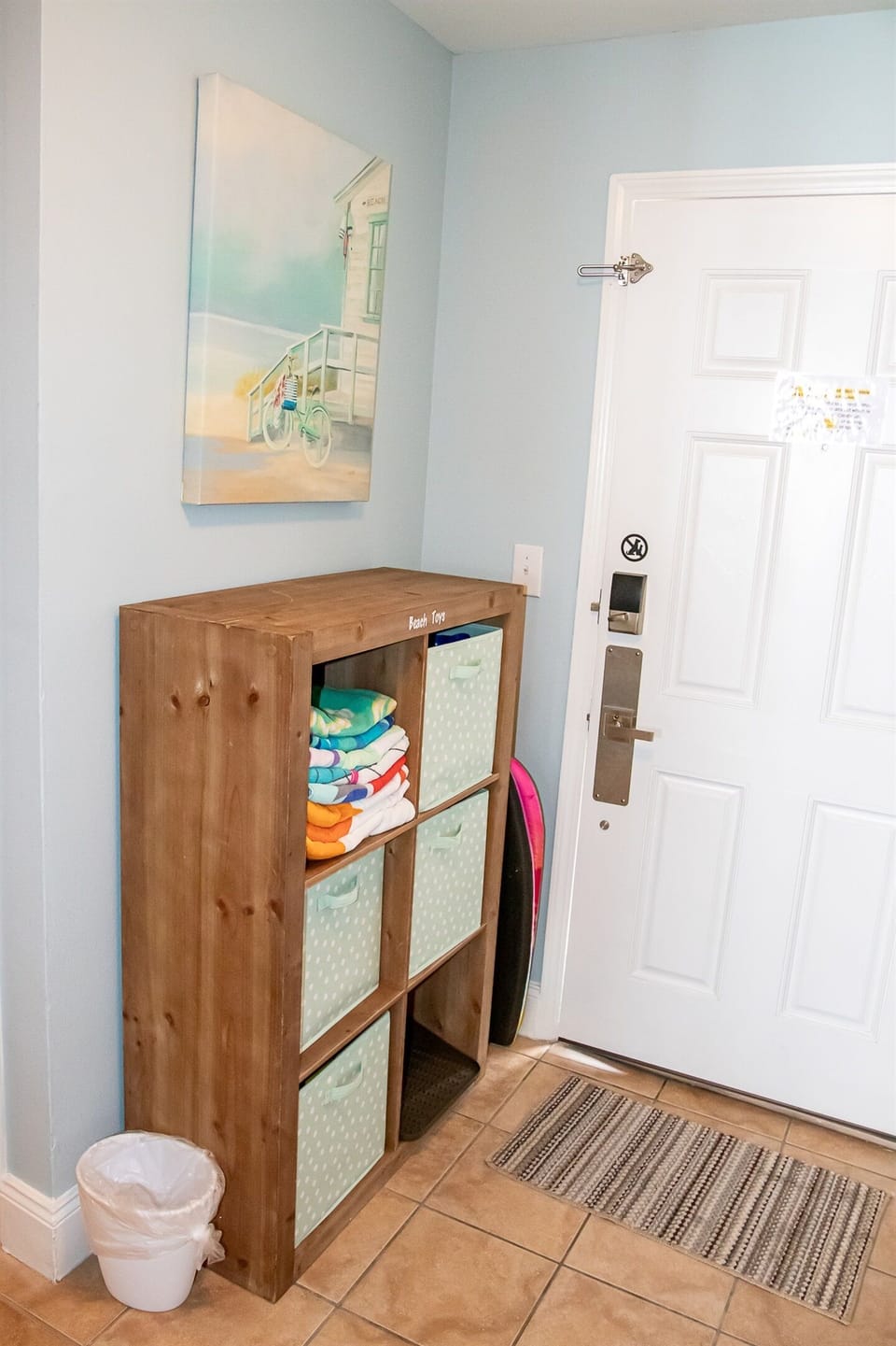 cubby of beach towels and toys to use during your stay