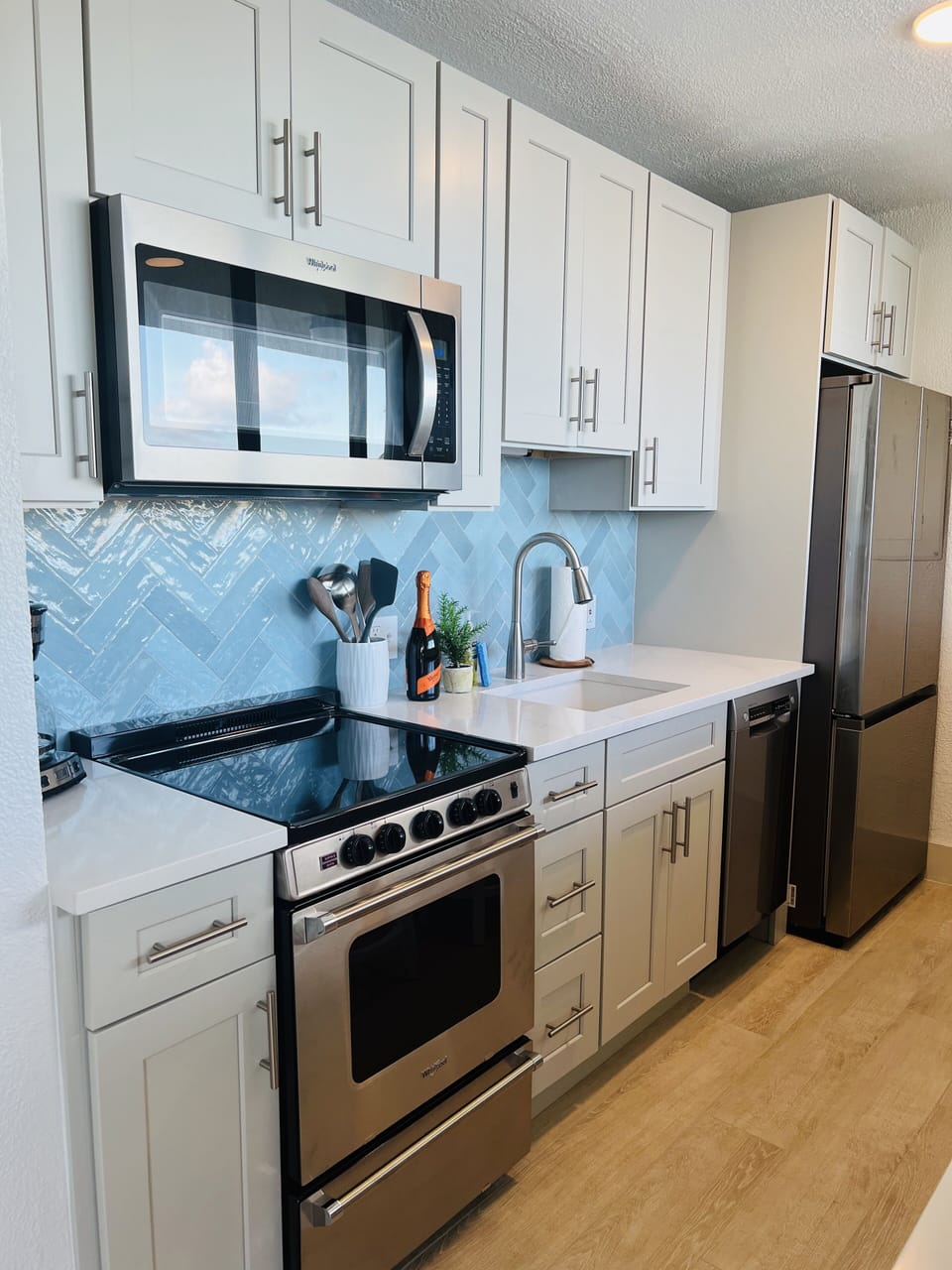 Fully stocked Kitchen with dishwasher plus bar seating facing the Ocean