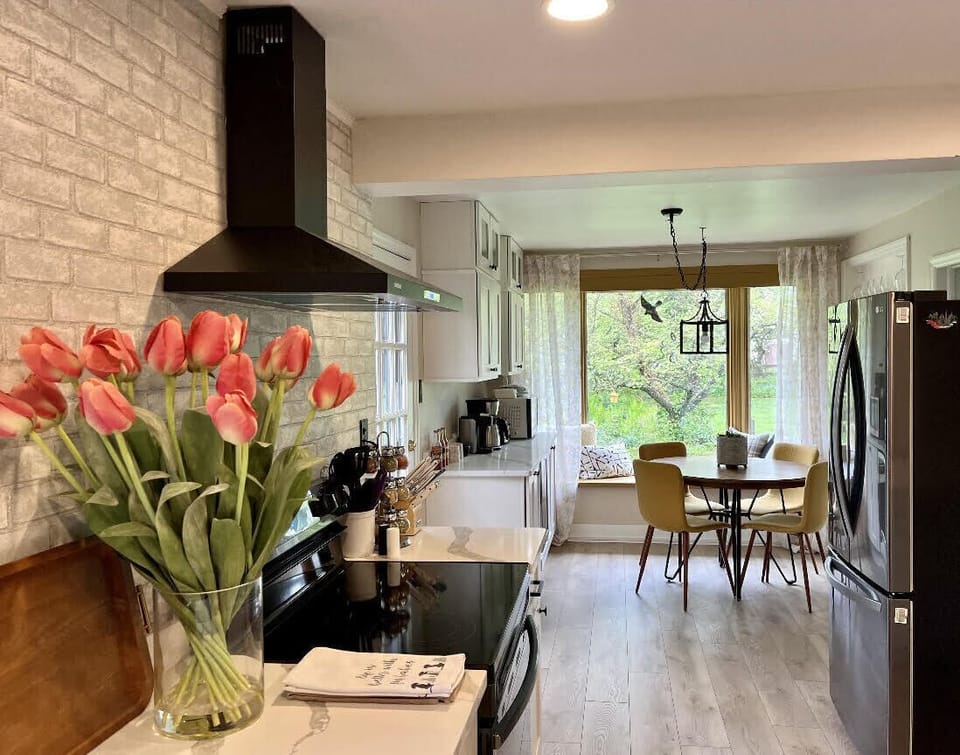 Enjoy a cup of coffee in a freshly designed nook area overlooking the backyard.