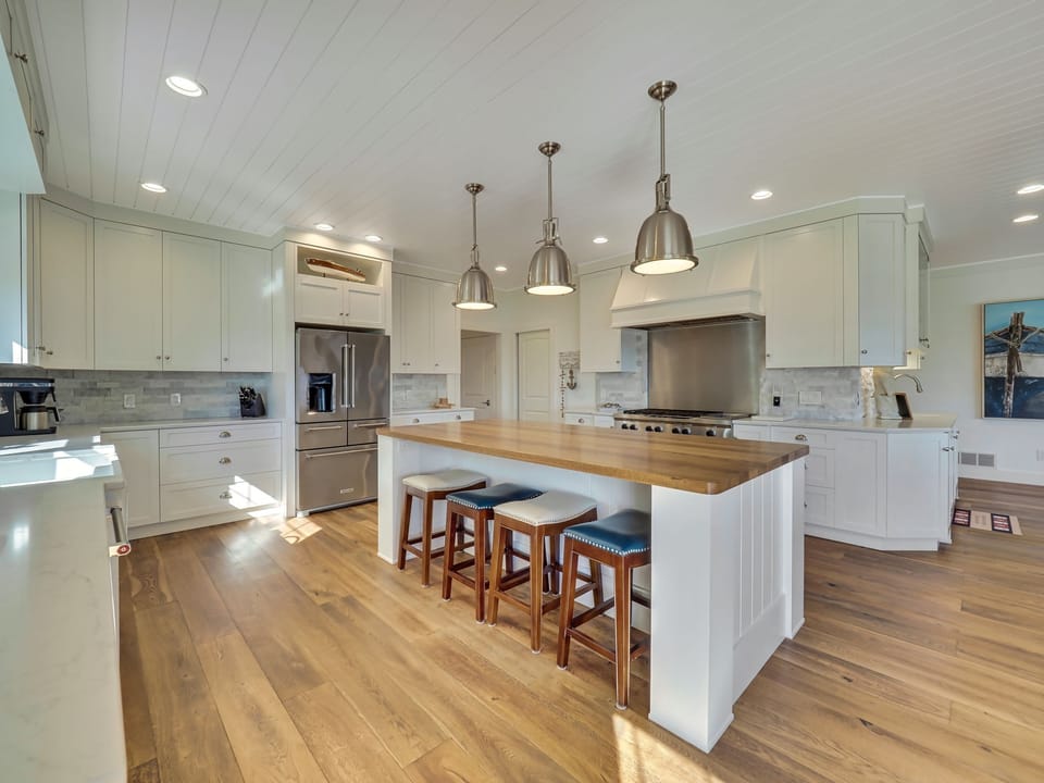 A chef's kitchen with large island (seats 8), double oven & spacious fridge