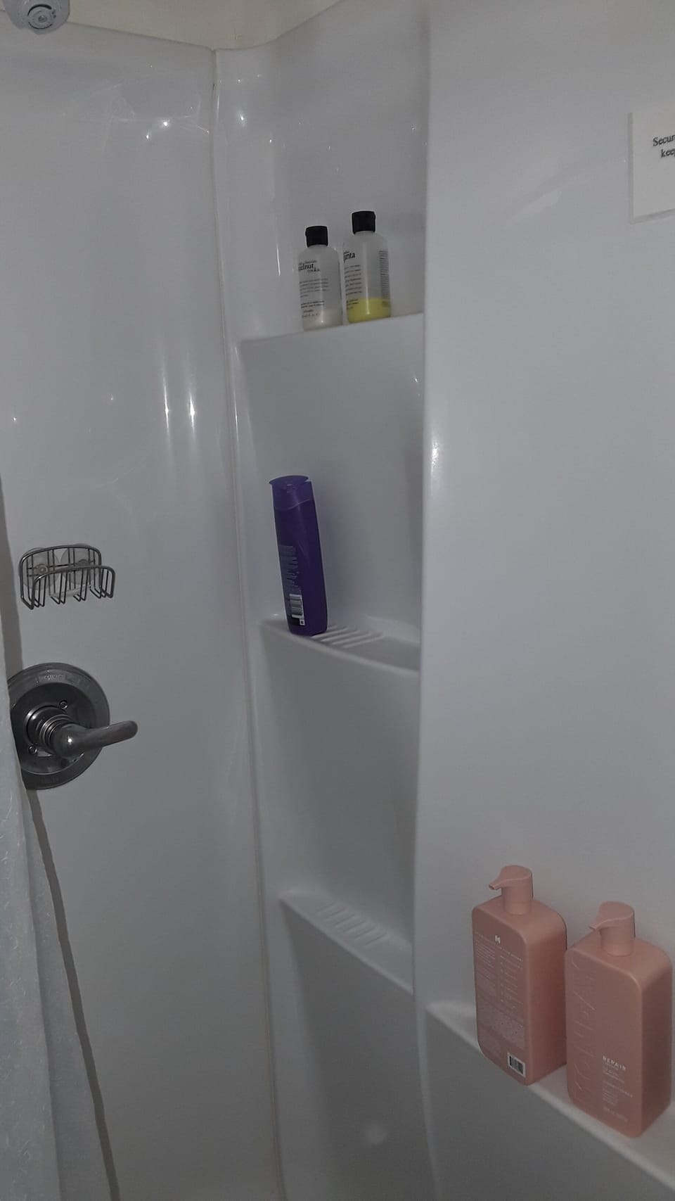 Shower with shampoo and bath soap.