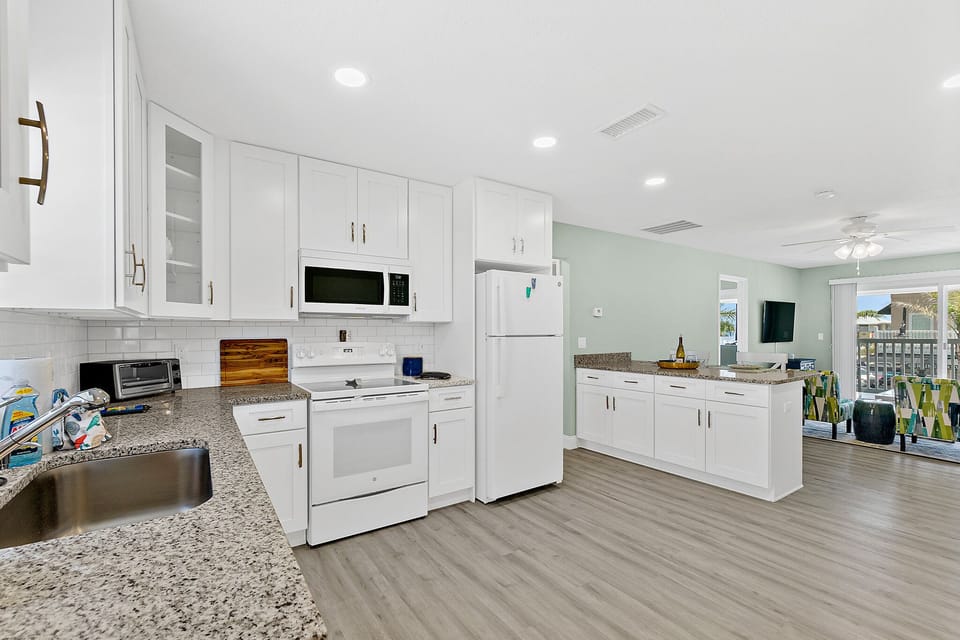 Spacious Kitchen with Island & Connecting Living Room